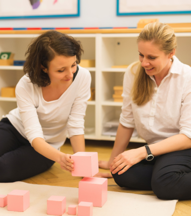 two Montessori guides when working with wooden Montessori materials