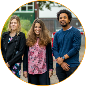 three Montessori Guides in After-School Club on the outside playground